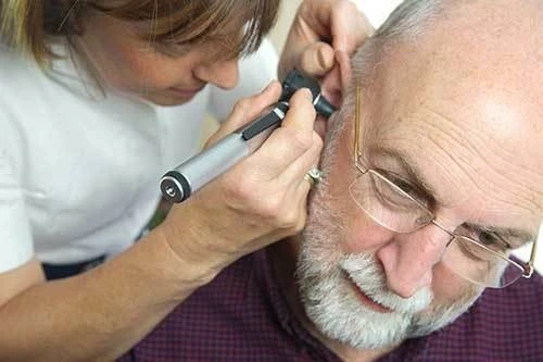 Professional ear examination with microscope
